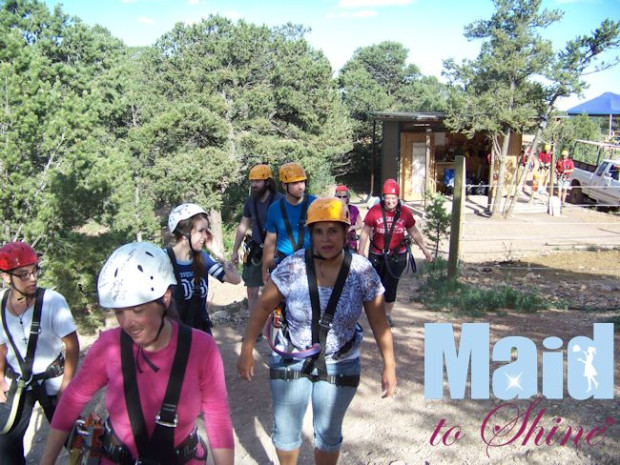 Team members walking to the first zip line